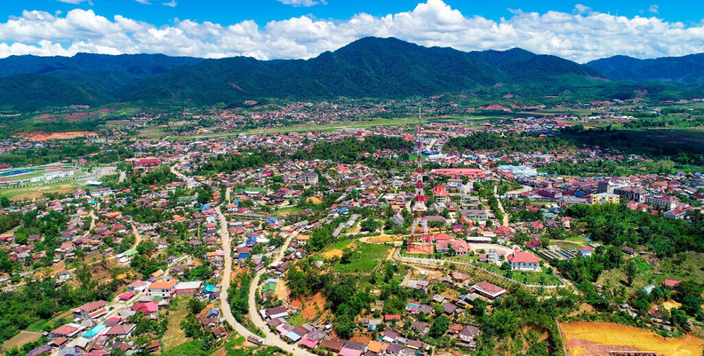 Start your journey with Muang Xay’s vibrant glow